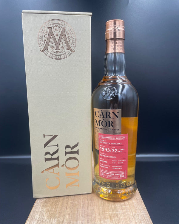 Bottle of Carn Mor Glen Keith whisky with its box on a dark surface