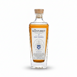 A 2025 bottle of The Glenturret 7 Year Peat Smoked Highland Single Malt Scotch Whisky, featuring a clear glass bottle with amber liquid inside, a light wood stopper, and a detailed white label with blue and black text.