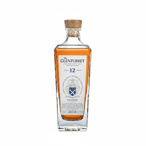 A bottle of The Glenturret 12 Years Old Scotch Whisky, 46.2%, showing the amber liquid inside a clear glass bottle with a wooden cork stopper and a white label.
