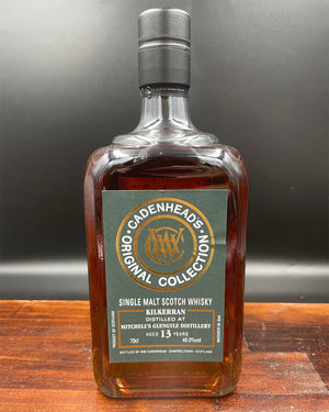 Bottle of Cadenheads Original Collection Kilkerran Single Malt Scotch Whisky on a wooden surface with a gray background